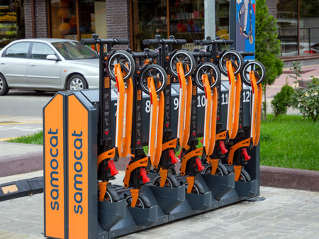 Russia, Voronezh - August 2019, 24: Parking of electric scooters in the residential complex Olympic,...