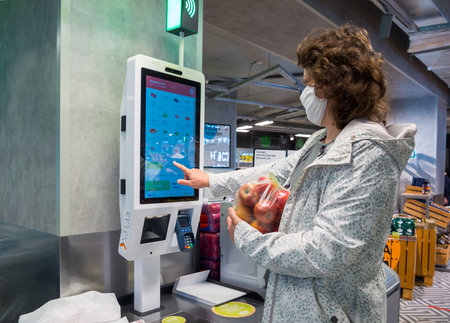 Russia, Voronezh - May 30, 2020: The customer at the self-service checkout in the Pyaterochka storeのeditorial素材