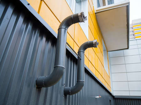 Fire hydrant pipes on the basement of the houseの写真素材