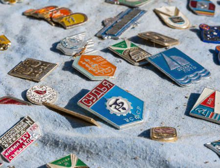 Sudak, Crimea - September 16, 2020: USSR era badges are sold at a flea marketのeditorial素材