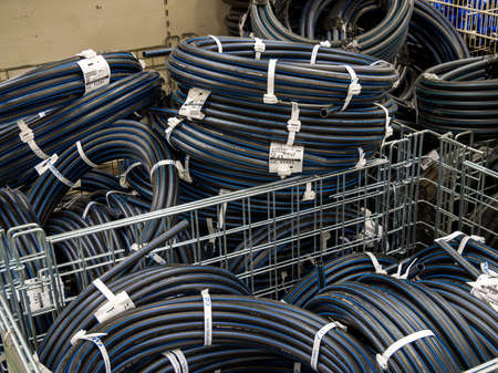 Voronezh, Russia - July 11, 2021: HDPE pipes for water lie in the containers of the storeのeditorial素材
