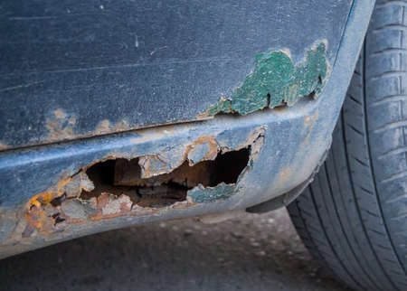 Decayed threshold and a fragment of a car doorの写真素材