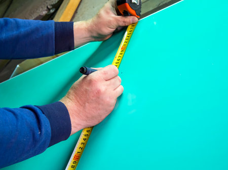 Layout of a sheet of a sandwich panel on a tape measureの写真素材