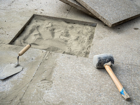 Laying large-format granite paving slabsの写真素材