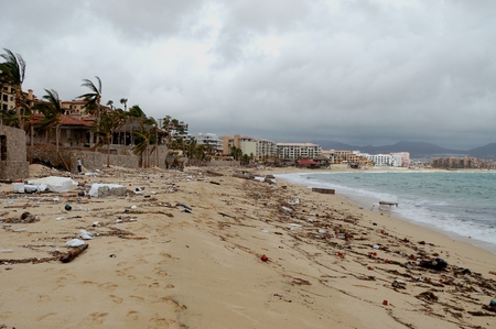 Damaged by hurricane Odile Medano beach front houses with trash on the beachのeditorial素材