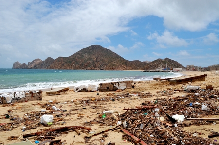 Trash on the Medano beach Cabo San Lucas and view of mountainsのeditorial素材