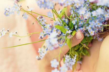 blue flowers the girl in the hands ofの写真素材