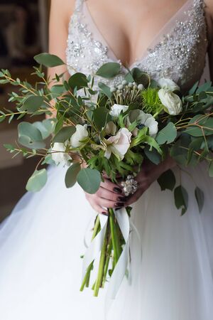 nice big wedding bouquet at bride's handsの写真素材