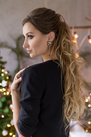 beautiful cute attractive girl in festive evening jewelry jewelryの写真素材
