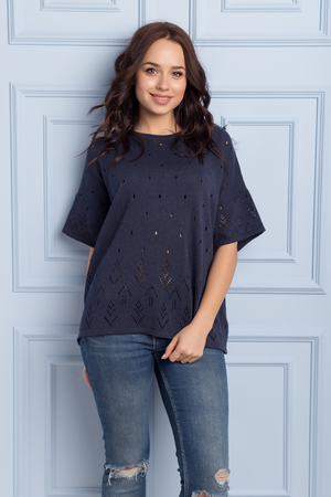beautiful cute girl with a smile demonstrates knitted clothesの写真素材