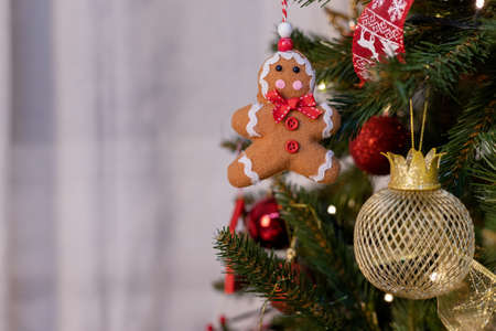 beautiful green christmas tree decoration with toys and ribbonsの写真素材