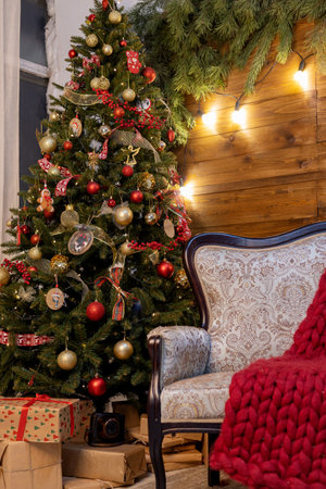 beautiful green christmas tree decoration with toys and ribbonsの写真素材