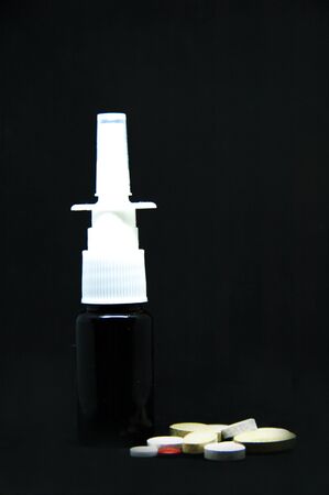 A person sitting at a table in a dark roomの写真素材