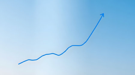 Blue arrow pointing up on blue sky background. Business success concept.の素材