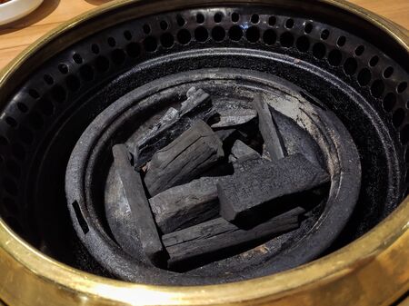Wood charcoal in Japanese BBQ restaurantの写真素材