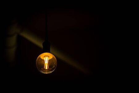 Vintage neon Light bulb in house の写真素材