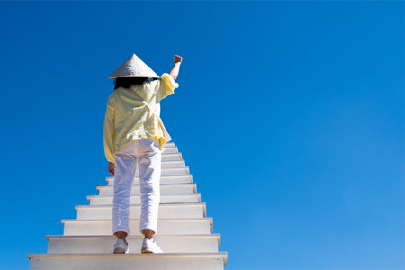 Feminism background concept, Right hand women and blue skyの写真素材