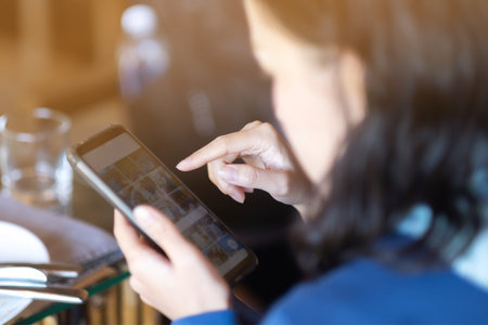 Women watching her pictures on smartphones