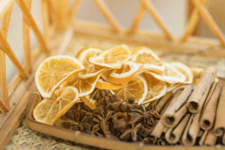 Dry lemon and some Chinese herb on wooden plate,soft focusの写真素材