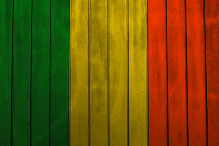 Green yellow red reggae background on wood wall textureの写真素材