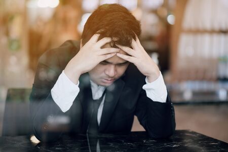 Asian men are worried about becoming unemployedの写真素材