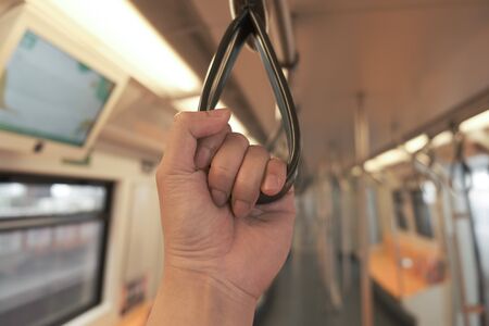 A man in public sky train in the cityの写真素材