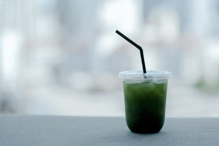A glass of ice matcha in cafe の写真素材