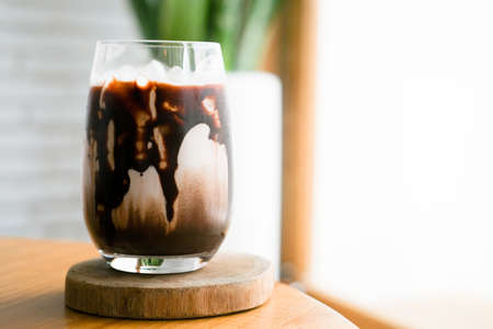 A glass of ice chocolate with milkの写真素材