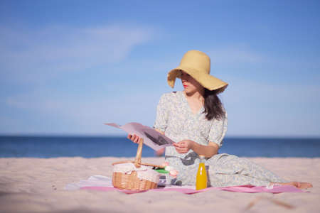 Asian  women picnic on the beachの写真素材