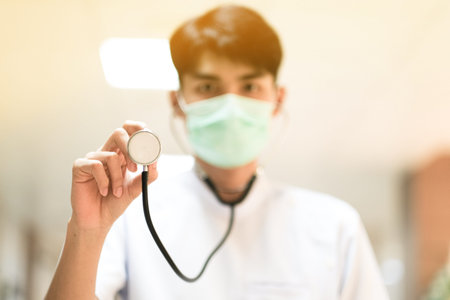 Asian doctor with surgical face mask and stethoscope