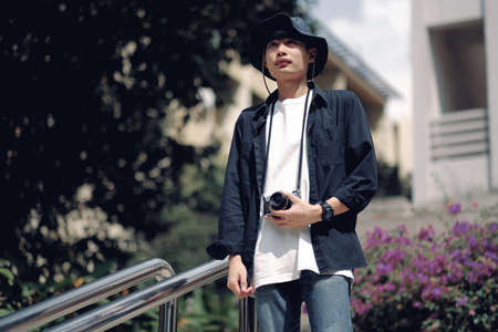 Asian travelers man and camera in train stationの写真素材