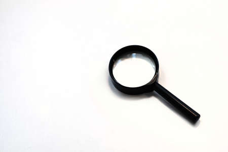 A black magnifying glass on a white backgroundの写真素材
