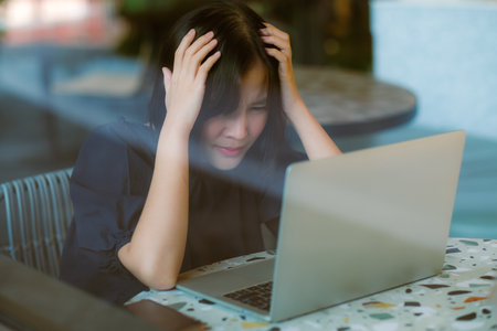 Asian women are worried about becoming unemployedの写真素材