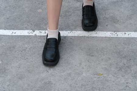 Women in black shoes on the street