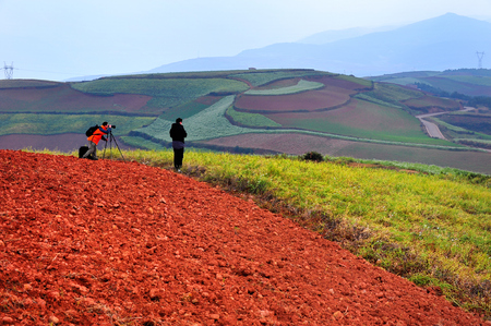 photographer taking photo of Dongchuan Yunnan red clay fieldのeditorial素材
