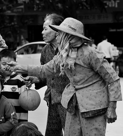 Elderly selling coconut at the beachのeditorial素材