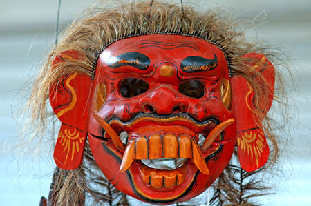 Indonesia, Java: red painted mask of a demon, an indonesian typical handcraft の写真素材