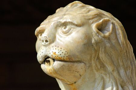 Portugal, Lisbon: Manueline architecture style, Jeronimo monastery; sculpted white stone with carved walls, statues row and archs; detail of a  fountaine statue: lionのeditorial素材