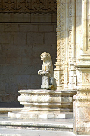 Portugal, Lisbon: Manueline architecture style, Jeronimo monastery; sculpted white stone with carved walls, statues row and archs; detail of a garden fountainのeditorial素材