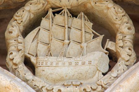 Portugal, Lisbon: Manueline architecture style, Jeronimo monastery; sculpted white stone with carved walls, statues row and archs; detail of the carved wall: the famous portuguese boat: caravelaのeditorial素材