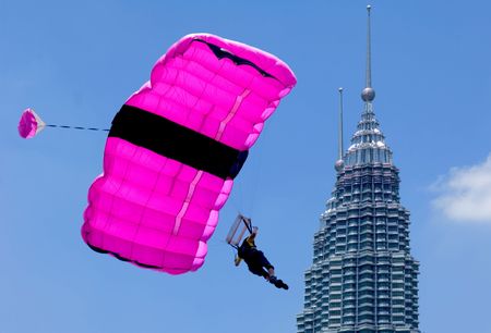 Malaysia Kuala Lumpur International exhibition of Tower Jump, blue sky and colorful parachute, twin towerのeditorial素材