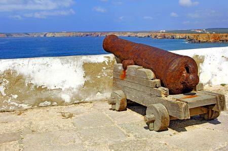 Portugal, area of Algarve, Sagres: ancient bronze canon at the fortress of Cabo de S Vincente, the extreme occidental pointe of Europeの写真素材