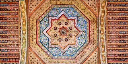 Morocco, Marrakesh: a polychrome ceiling decoration with the traditional geometrical designs in blue and red の写真素材