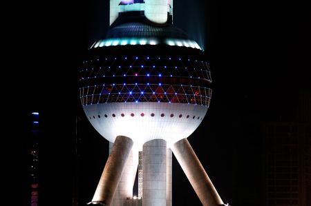 China, Shanghai; innovation on the architectural design; economic growth and modern architecture; The  oriental pearl tv tower ; a modern building in the shape of a pearl view during the nightのeditorial素材