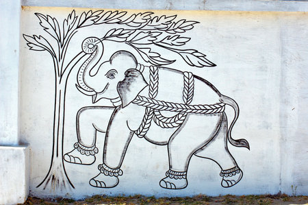 India, Udaipur: fresco on a wall; black and white representation of an elephant and a tree;  antique paintings of mehwarの写真素材