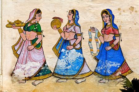 India, Udaipur: fresco on a wall; colorful indian women  in traditional dress ; antique paintings of mehwarの写真素材