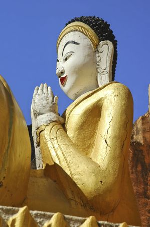 Myanmar, Inle Lake: Buddha sculpture in Nanthe Paya; giant golden color seated buddhaの写真素材