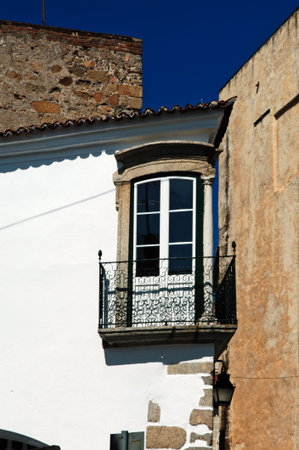 traditional  street of Evora city, white houses and red tiles a typical view from the south of the...