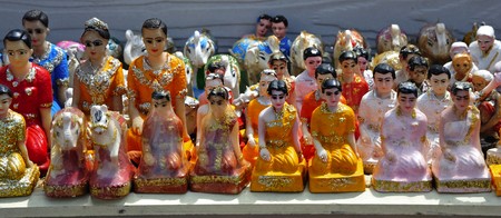 Thailand; Pattaya; view of small religious statues on the foot of the monument to the admiral Krom Jumborn near the Jomtien beachの写真素材
