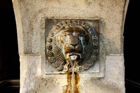 Switzerland , Luzern: View of an ancient  fountain during winter timeの写真素材